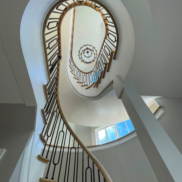 Project #95 | Freestanding Elliptical Staircase with Geometric Iron Balusters