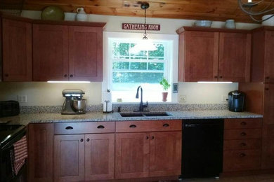 Inspiration for a mid-sized contemporary l-shaped eat-in kitchen remodel in Portland Maine with a double-bowl sink, shaker cabinets, medium tone wood cabinets, granite countertops, black appliances and no island
