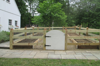 Example of a country home design design in Philadelphia