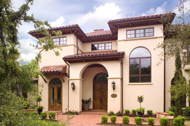 Large mediterranean exterior home idea in Houston
