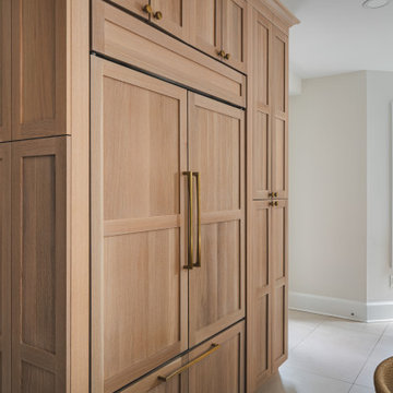 Scandinavian Kitchen with Light Oak Cabinets and Quartzite Island