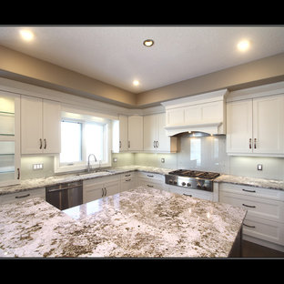 Mid-sized modern kitchen pantry remodeling - Mid-sized minimalist l-shaped dark wood floor kitchen pantry photo in Edmonton with an undermount sink, white cabinets, granite countertops, gray backsplash, glass sheet backsplash, stainless steel appliances and an island