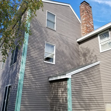 Painting a house in Beverly
