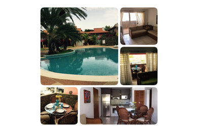 Example of a beach style home design design in Other