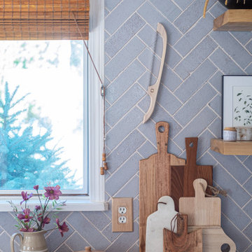 Farmhouse Style Kitchen with Herringbone Brick Backsplash