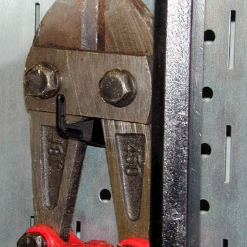 Industrial Pegboard. Wall Control metal pegboard being used to hang heavy duty b