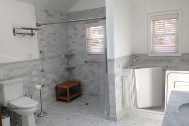 Example of a large master gray tile doorless shower design in Other with white walls