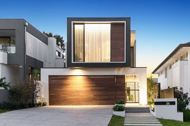 Large modern two-storey house exterior in Perth with wood siding, a flat roof and a metal roof.
