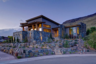 Large trendy brown two-story mixed siding house exterior photo in Denver with a shed roof and a shingle roof