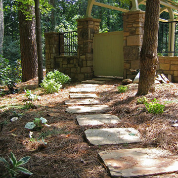 Fieldstone stepping stones, Columns and sitting wall; Barrel Arbor, Wrought iron