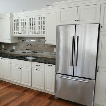 Traditional White Kitchen Remodel with Cook top in the peninsula