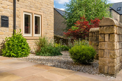 Design ideas for a medium sized contemporary front garden with gravel.