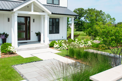Inspiration for a large farmhouse full sun front yard walkway in Milwaukee.