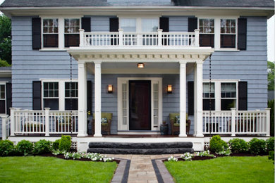 Large contemporary two-storey blue house exterior in Portland with wood siding, a gable roof and a shingle roof.