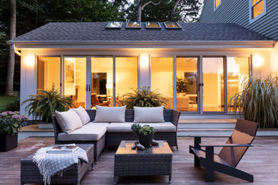 Inspiration for a large contemporary backyard patio in New York with decking and no cover.