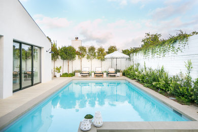 Beach style rectangular pool photo in Orange County