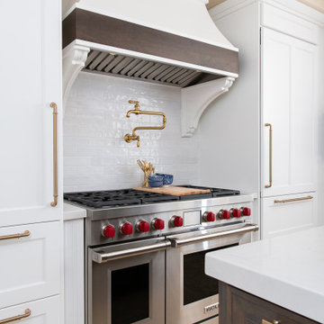 Custom curved hood with large wooden corbels