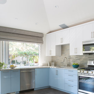 Mid-sized transitional open concept kitchen designs - Mid-sized transitional l-shaped porcelain floor and gray floor open concept kitchen photo in San Francisco with an undermount sink, flat-panel cabinets, blue cabinets, quartzite countertops, beige backsplash, glass tile backsplash, stainless steel appliances and no island