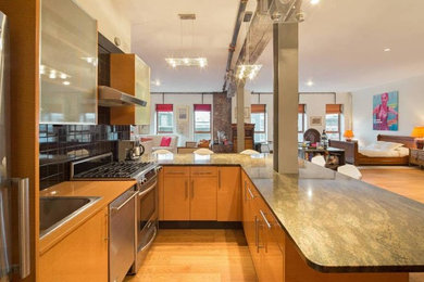 Inspiration for a small contemporary u-shaped light wood floor open concept kitchen remodel in New York with a drop-in sink, flat-panel cabinets, light wood cabinets, black backsplash, subway tile backsplash, stainless steel appliances and a peninsula