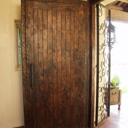 Spanish style solid wood entry door with hand carving. Hand forged iron door pul - Front Doors