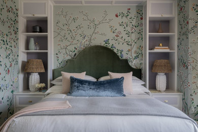 Mid-sized master medium tone wood floor, gray floor and wallpaper bedroom photo in Boston with green walls