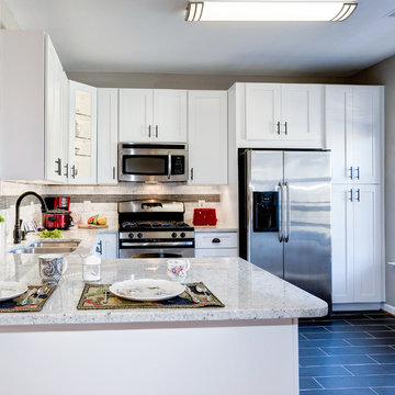 White Kitchen Remodel with Colonial White Granite and Stainless Steel Appliances
