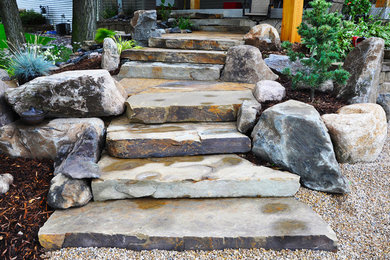 Design ideas for a front yard stone landscaping in Other.