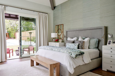 Transitional master medium tone wood floor, vaulted ceiling and wallpaper bedroom photo in Austin