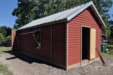 Inspiration for a farmhouse garage remodel in Orlando