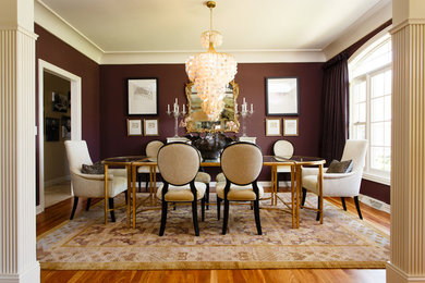 Large transitional light wood floor enclosed dining room photo in Milwaukee with no fireplace and brown walls