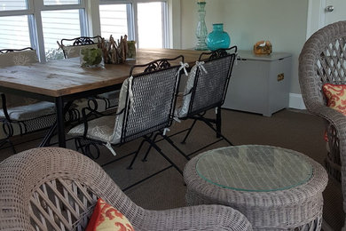 This is an example of a beach style sunroom in Boston.