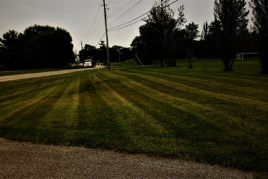 Photo of a mid-sized full sun front yard mulch landscaping in Indianapolis for spring.