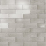 Merola Tile - Coco Glossy Amber Grey Porcelain Wall Tile - Offering a subway look, our Coco Glossy Amber Grey Porcelain Wall Tile features a smooth, glossy finish, providing decorative appeal that adapts to a variety of stylistic contexts. Containing 100 different print variations that are randomly distributed throughout each case, this gray rectangle tile offers a one-of-a-kind look. With its impervious, frost-resistant features, this tile is an ideal selection for both indoor and outdoor commercial and residential installations, including kitchens, bathrooms, backsplashes, showers, hallways and fireplace facades. This tile is a perfect choice on its own or paired with other products in the Coco Collection. Tile is the better choice for your space!