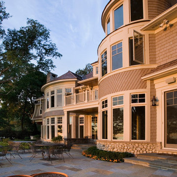 Rear Elevation of Cape Cod Stone and Shingle Style House with Bluestone Terrace