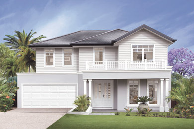 This is an example of a beach style two-storey house exterior in Brisbane with a gable roof.