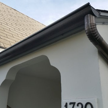 Bonderized Steel, 5 inch Half Round Seamless Gutters with Round Downspouts.