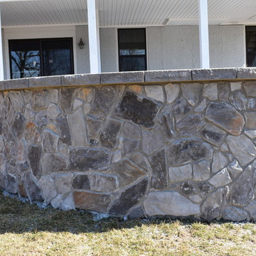 Stamped Concrete with Stone fire pit and stone wall