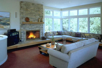 Inspiration for a mid-sized contemporary open concept carpeted and brown floor living room remodel in San Francisco with white walls, a standard fireplace, a stone fireplace and a tv stand