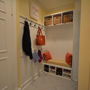 Mid-sized traditional kitchen pantry inspiration - Example of a mid-sized classic galley ceramic floor kitchen pantry design in Baltimore with a farmhouse sink, raised-panel cabinets, white cabinets, granite countertops, white backsplash, ceramic backsplash, stainless steel appliances and no island