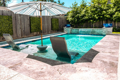 Example of a small beach style backyard rectangular pool design in Houston