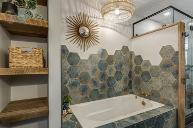 Bathroom - small eclectic master multicolored tile ceramic tile, black floor, double-sink and wallpaper bathroom idea in Other with shaker cabinets, medium tone wood cabinets, a one-piece toilet, multicolored walls, an undermount sink, granite countertops, a hinged shower door, black countertops, a niche and a freestanding vanity
