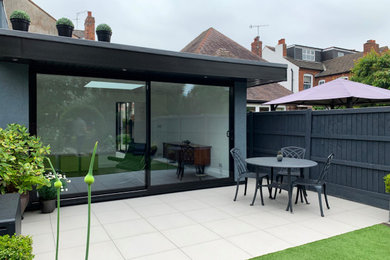 The modern extension fits perfectly in the garden