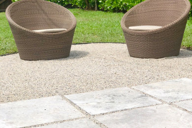 Patio kitchen - mid-sized coastal backyard stone patio kitchen idea in Miami with no cover