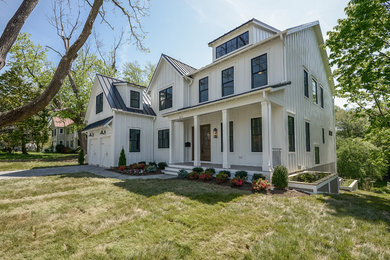 Huge minimalist white three-story gable roof photo in DC Metro