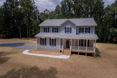 Example of a large classic blue two-story concrete fiberboard exterior home design in Richmond with a shingle roof
