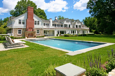 Inspiration for a backyard rectangular hot tub remodel in New York