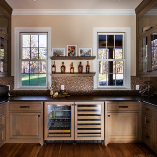 Rustic Tile Kitchen Bars example of a mountain style u shaped medium tone wood floor home bar design in