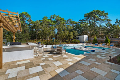 Mid-sized modern backyard custom-shaped pool in Miami with concrete pavers.