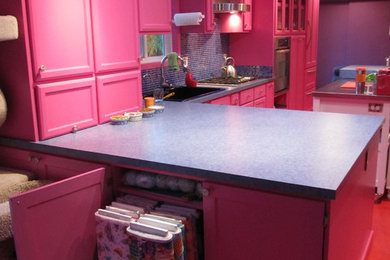 Inspiration for an eclectic l-shaped eat-in kitchen remodel in Other with a drop-in sink and shaker cabinets