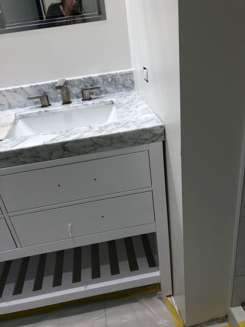 how to fill a gap between vanity and side wall, baseboard issue too